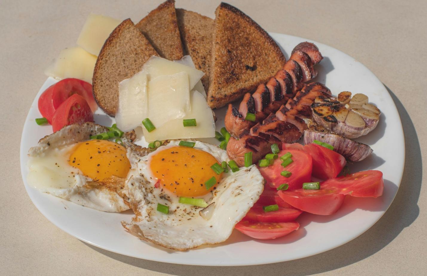 Freshly baked pastries cooling on racks in professional studio kitchen environment
